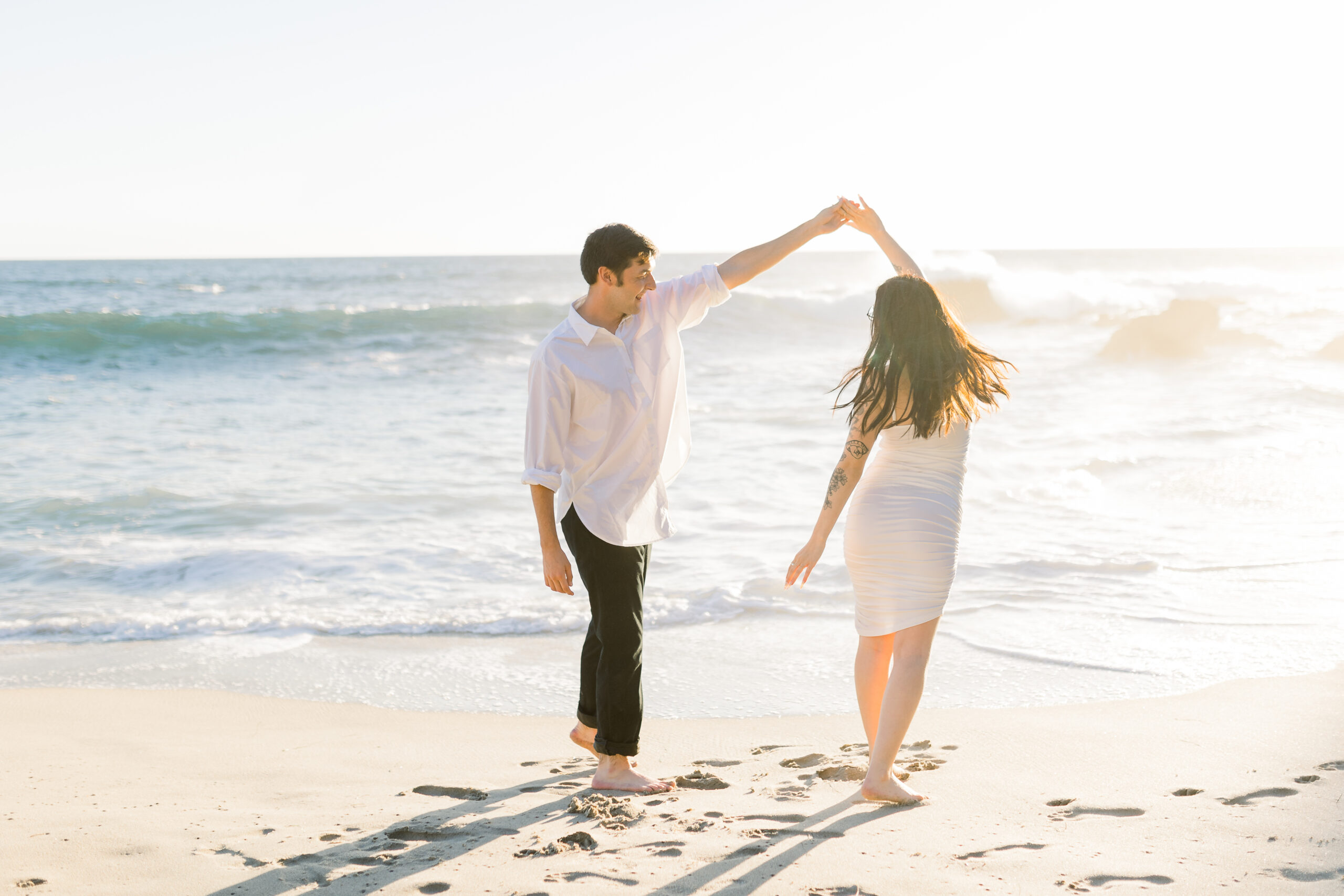 Couple dancing by the beach