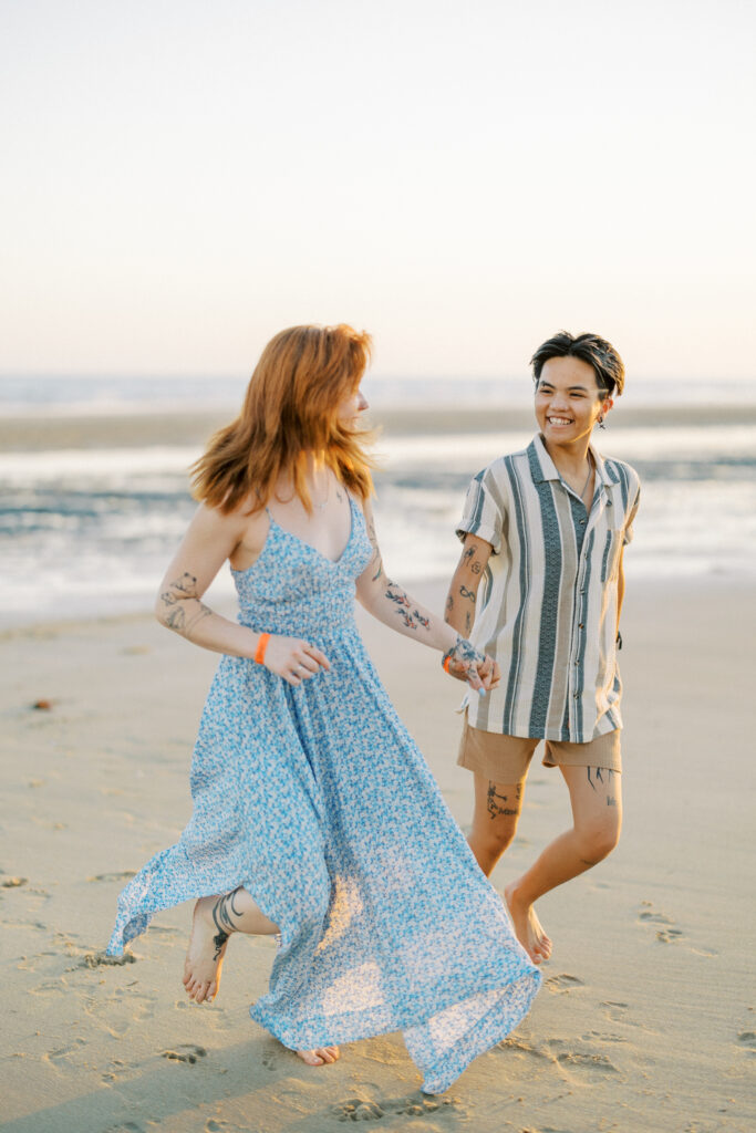 couple running by the beach